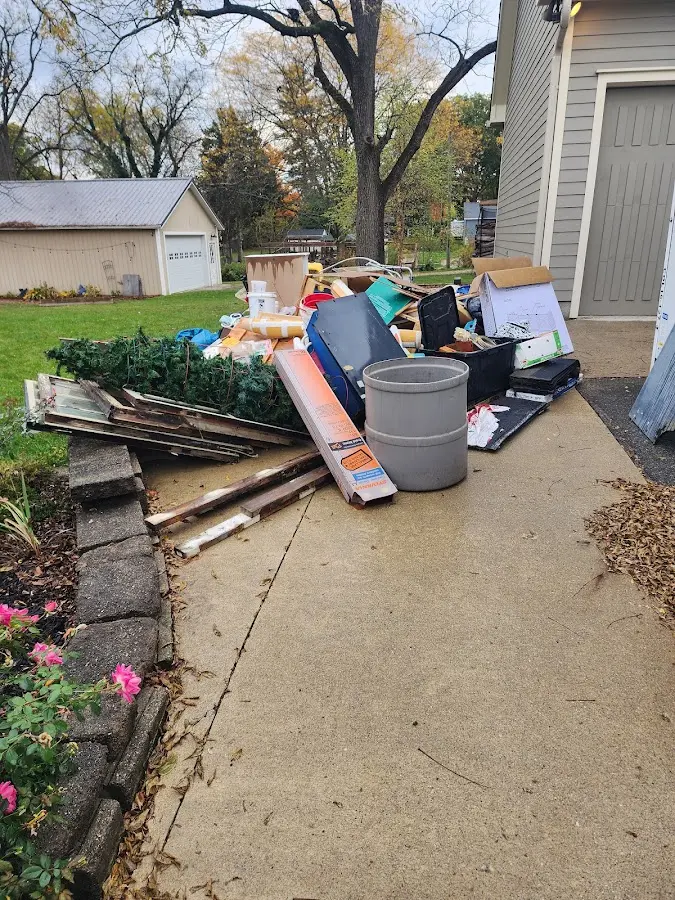 Dumpster being loaded with debris for 3 Yard Dumpster Rental in Rosedale